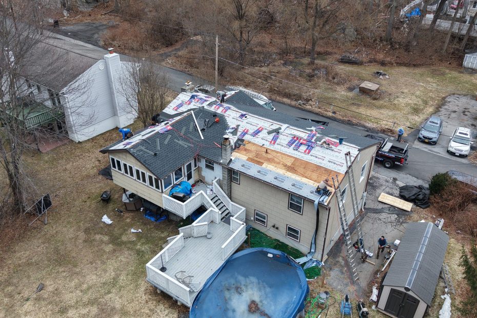 Roof being repaired by a roof company